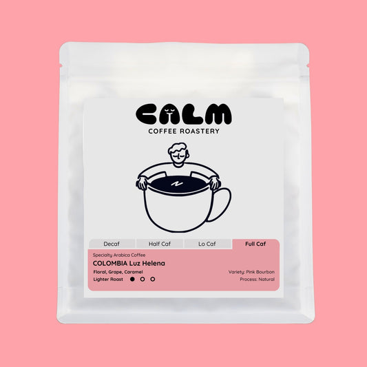 Calm Coffee Roastery coffee package on a pink background
