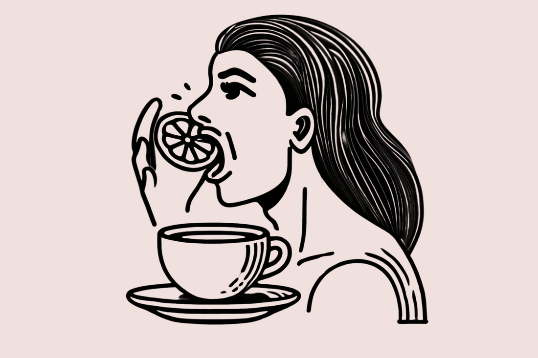 Lady biting into a lemon to experience acidity similar to that found in lighter roast coffees