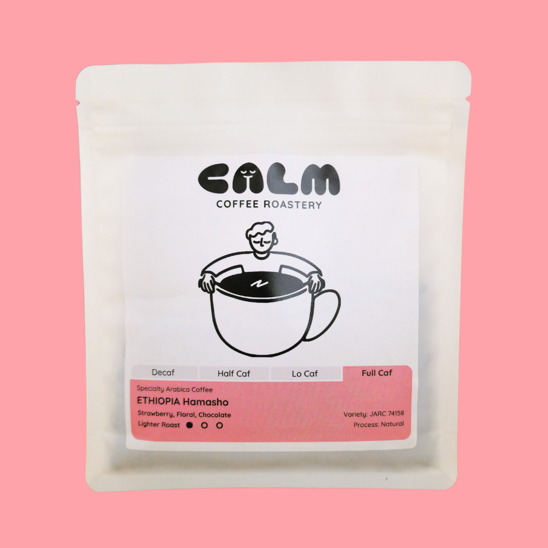 Full Caf Ethiopia Hamasho coffee bag with Calm Coffee Roastery branding, highlighting tasting notes of strawberry, floral, and chocolate.